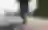 A person walking beside an urban waterfront